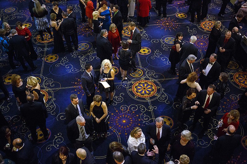 Patrons talk over drinks before the start of the meal and ceremonies Friday evening at Capitol Plaza Hotel during the annual Jefferson City Chamber of Commerce Gala.