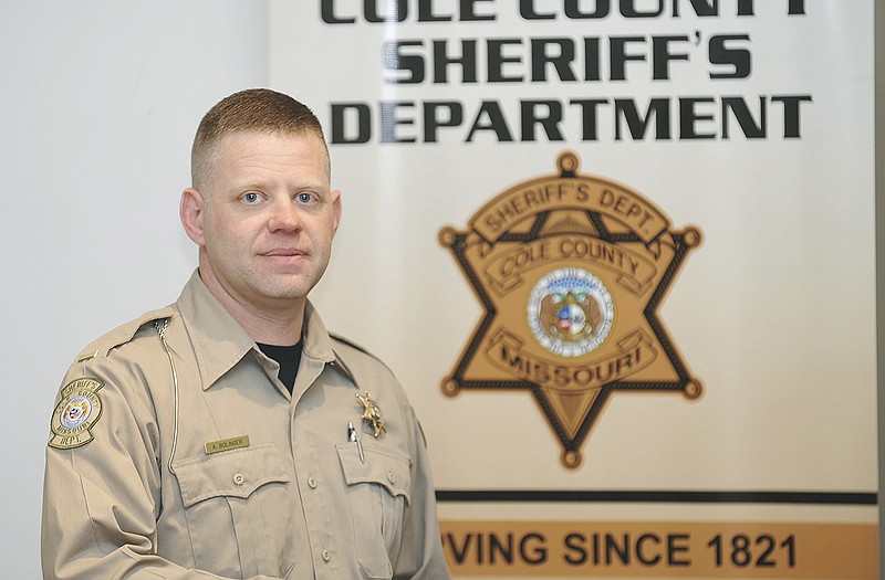 Lt. Aaron Bollinger poses in the Cole County Sheriff's Department conference room.