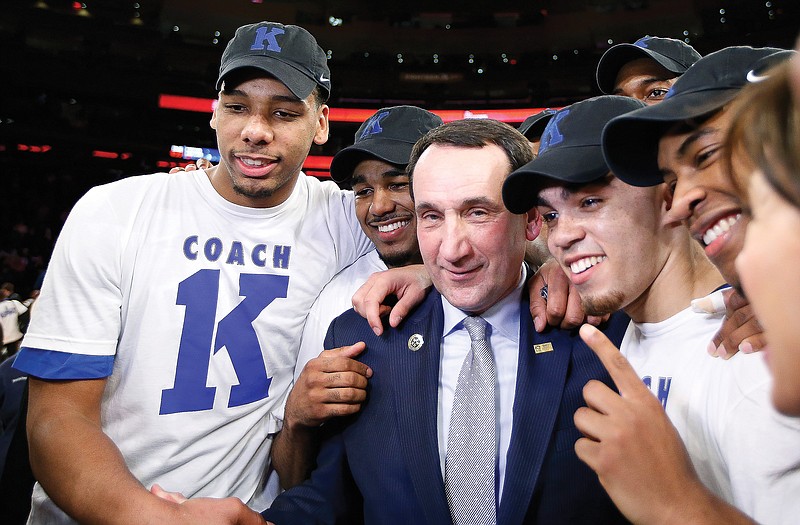 Duke head coach Mike Krzyzewski celebrates with his players Sunday after beating St. John's in New York for his 1,000th career win.