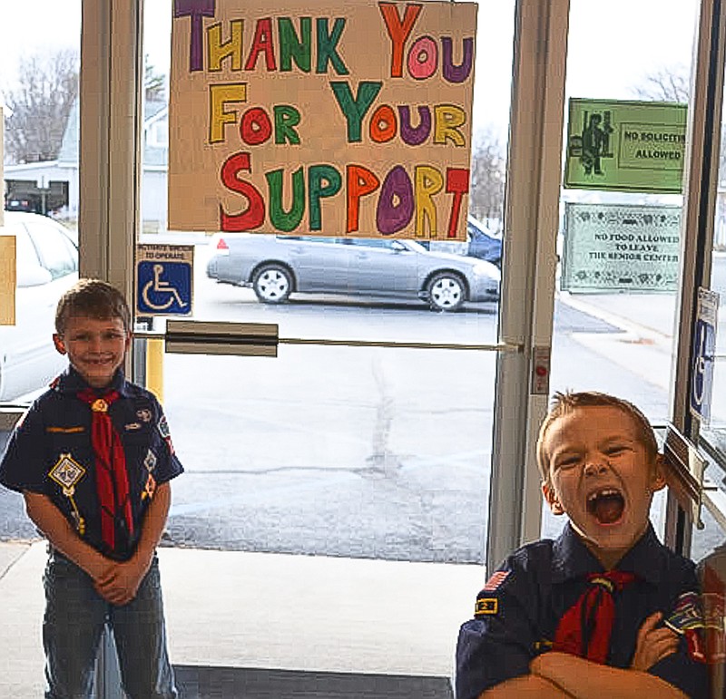 Cub Scouts Gabe and Reece man the door into the California Nutrition Center for the Annual Cub Scout Chili Supper Fundraiser.