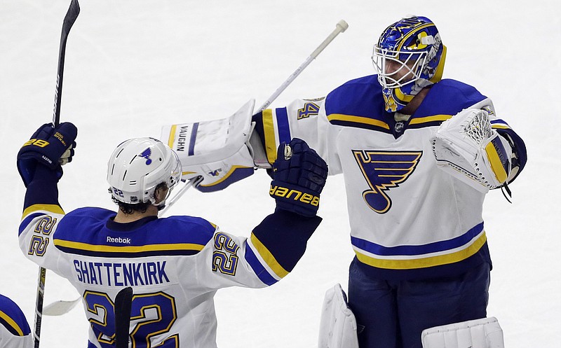 St. Louis Blues' Kevin Shattenkirk (22) and goalie Jake Allen react following Shattenkirk's goal in the shootout against the Carolina Hurricanes in an NHL hockey game in Raleigh, N.C., Friday, Jan. 30, 2015. St. Louis won 3-2. 