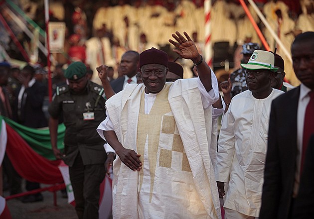 Nigerian President Goodluck Jonathan waves at supporters in Yola, Nigeria, Thursday. Youths angry at the Nigerian government's failure to fight Islamic extremists threw stones Thursday at President Goodluck Jonathan's electioneering convoy in the eastern town of Jalingo, breaking windshields and windows on several vehicles.