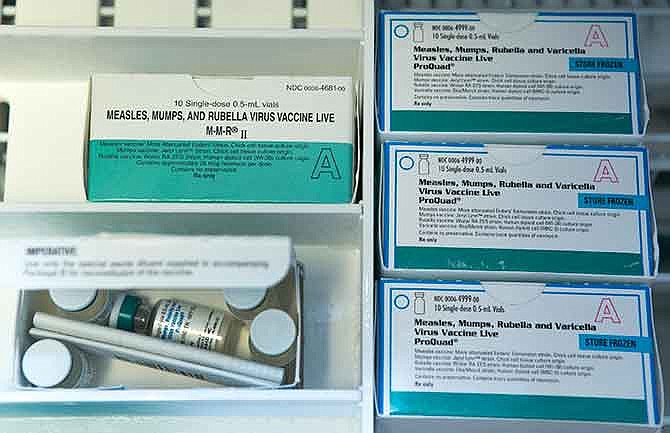 Boxes of single-doses vials of the measles-mumps-rubella virus vaccine live, or MMR vaccine and ProQuad vaccine are kept frozen inside a freezer at the practice of Dr. Charles Goodman in Northridge, Calif., Thursday, Jan. 29, 2015.