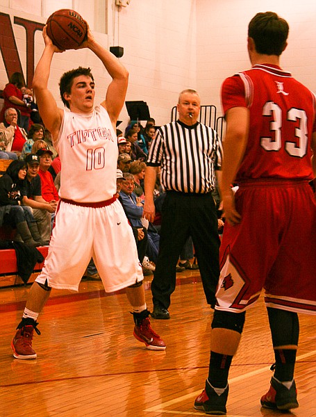 Tipton junior Ryan Wood attempts to make a pass in his team's game against Lincoln on Tuesday, Jan. 27.