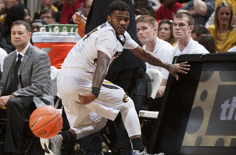 Missouri's Keith Shamburger saves a ball from going out of bounds in front of the Missouri bench during the second half of Saturday's game against Texas A&M at Mizzou Arena.