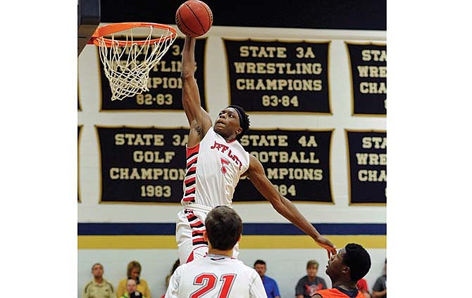 Jefferson City's O.G. Anunoby soars for a dunk during Saturday's game against Madison Prep at Rackers Fieldhouse.