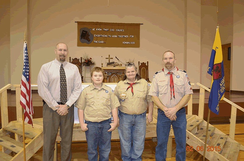 Webelos Leader Matt Abernathy, newest member of Boy Scout Troop 120 Matthew J. Abernathy, Webelos Leader Rose Blair, and Cubmaster Brad Friedmeyer.