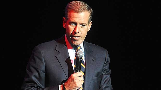  In this Nov. 5, 2014 file photo, Brian Williams speaks at the 8th Annual Stand Up For Heroes, presented by New York Comedy Festival and The Bob Woodruff Foundation in New York. NBC says it is suspending Brian Williams as "Nightly News" anchor and managing editor for six months without pay for misleading the public about his experiences covering the Iraq War. NBC chief executive Steve Burke said Tuesday, Feb. 10, 2015, that Williams' actions were inexcusable and jeopardized the trust he has built up with viewers during his decade as the network's lead anchor. 