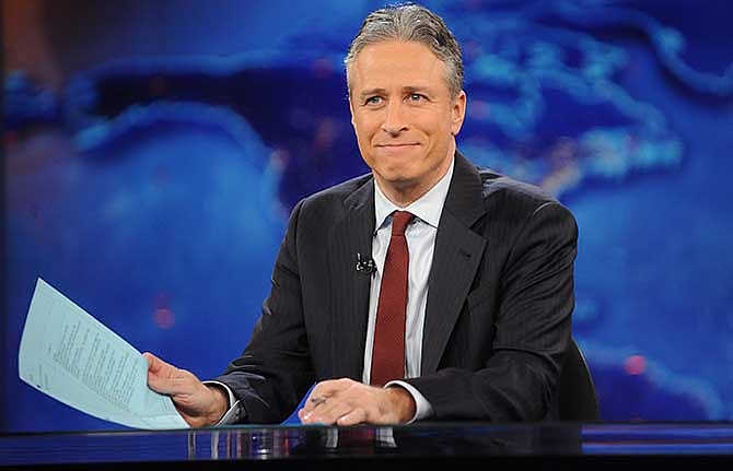 This Nov. 30, 2011 file photo shows television host Jon Stewart during a taping of "The Daily Show with Jon Stewart" in New York. Comedy Central announced Tuesday, Feb. 10, 2015, that Stewart will will leave "The Daily Show" later this year.