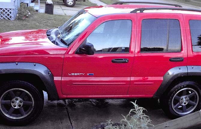 This undated photo provided by the estate of Kayla White shows White's 2003 Jeep Liberty. White was killed in November 2014 after her SUV was hit from behind by a Cadillac STS, bounced of a Nissan in front of it, rolled onto its left side and burst into flames. The vehicle was part of Chrysler's June 2013 recall of 1.56 million Jeeps at risk of catching fire when struck from behind.