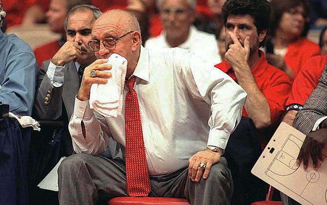 In this Nov. 15, 1995, file photo, Fresno State coach Jerry Tarkanian watches his team play Weber State during the preseason NIT in Fresno, Calif. Hall of Fame coach Jerry Tarkanian, who built a basketball dynasty at UNLV but was defined more by his decades-long battle with the NCAA, died Wednesday, Feb. 11, 2015, in Las Vegas after several years of health issues. He was 84.