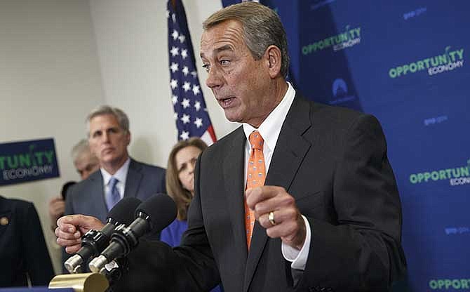 House Speaker John Boehner of Ohio, joined by, from left, House Majority Leader Kevin McCarthy of Calif., and Rep. Lynn Jenkins, R-Kansas, says Senate Democrats should "get off their ass" and pass a bill to fund the Homeland Security Department and restrict President Barack Obama's executive moves on immigration, Wednesday, Feb. 11, 2015 during a news conference following a GOP strategy meeting, on Capitol Hill in Washington. His comments Wednesday underscored a worsening stalemate on Capitol Hill with funding for the Homeland Security Department set to expire Feb. 27. A day earlier, Senate Majority Leader Mitch McConnell declared the Senate "stuck" on the issue and said the next move was in the House's court.