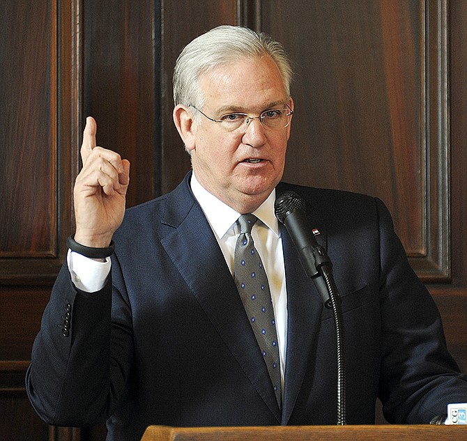 Gov. Jay Nixon addresses members of the media following the annual Missouri Press Association luncheon at the governor's mansion.