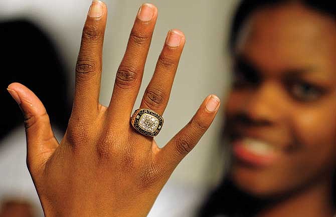 Lincoln University distance runner Akeeba Rose proudly displays her national track and field championship ring following Wednesday's presentation ceremony held at Jason Gym between the women's and men's basketblal games against Central Missouri.