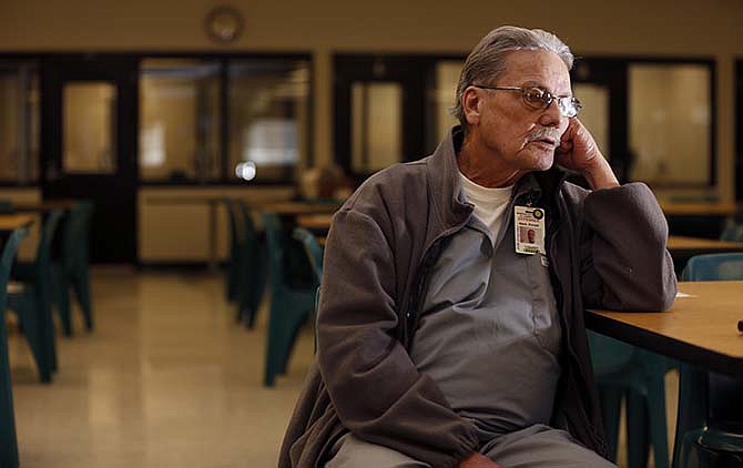 In this photo made Jan. 22, 2015, Donald "Doc" Nash, 72, speaks during an interview at Eastern Reception, Diagnostic and Correctional Center in Bonne Terre, Mo., where he is serving a life sentence for the murder of an ex-girlfriend. Nash is appealing his conviction, enlisting the help of three former sheriff's deputies who say they planned to arrest another person in the murder before state troopers intervened.