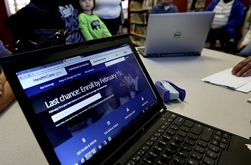 A laptop shows the HealthCare.com web site during an Affordable Care Act enrollment event at the Fort Worth Public Library in Fort Worth, Texas.