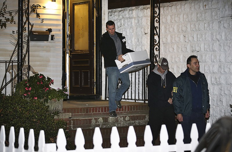 FBI agents remove evidence from the Brooklyn residence of Rabbi Mendel Epstein during an investigation, in New York. Several defendants, including Epstein and another rabbi, are accused by the FBI of plotting to kidnap and beat a man to force him to grant a religious divorce. Epsteins trial starts today in federal court in New Jersey.