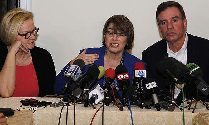 Senator Amy Klobuchar of Minnesota speaks during a press conference with fellow senators Claire McCaskill of Missouri, left, and Mark Warner of Virginia in Havana, Cuba, Tuesday, Feb. 17, 2015. The delegation is in Cuba in support of a bill Klobuchar is sponsoring to lift the U.S. trade embargo on Cuba. According to the senators, a new round of negotiations to restore full diplomatic ties with Cuba will take place next week in Washington.