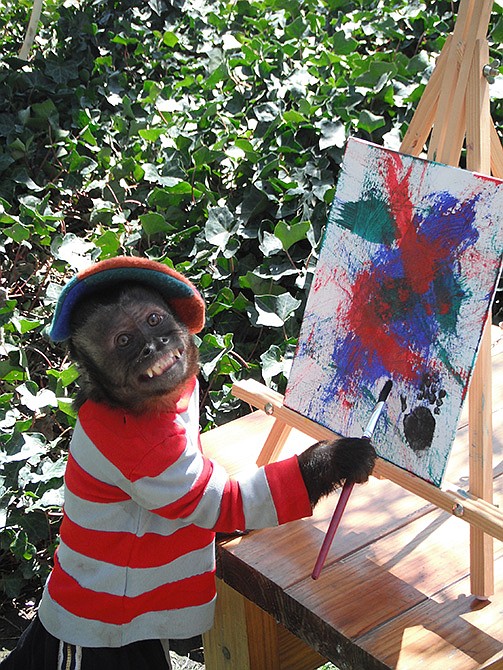 This 2008 photo shows Crystal, a 1-foot-7-inch female Capuchin monkey painting in her home in Los Angeles. Crystal, an animal actor who has starred in more than 25 movies over nearly two decades, has received a lifetime diva achievement award as part of the 6th annual American Humane Association Pawscars, the animal version of the Oscars.