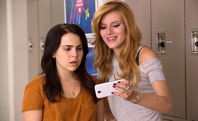 In this image released by CBS Films, Mae Whitman, left, and Bella Thorne appear in a scene from "The DUFF."