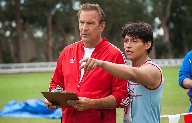 In this image released by Disney, Kevin Costner, foreground left, and Carlos Pratts appear in a scene from "McFarland, USA."