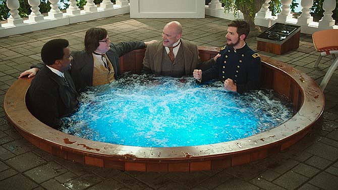 In this image released by Paramount Pictures/MGM, Craig Robinson, from left, Clark Duke, Rob Corddry and Adam Scott appear in a scene from "Hot Tub Time Machine 2." 