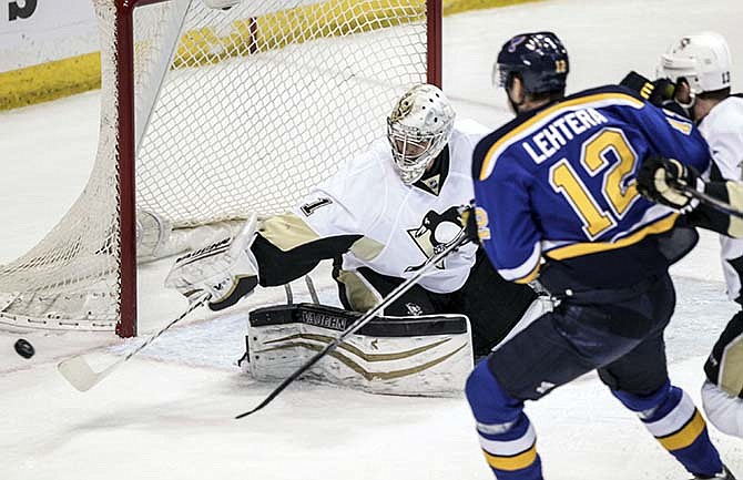 Pittsburgh Penguins goalie Thomas Greiss, of Germany, blocks a shot during the first period of an NHL hockey game against the St. Louis Blues Saturday, Feb. 21, 2015, in St. Louis.