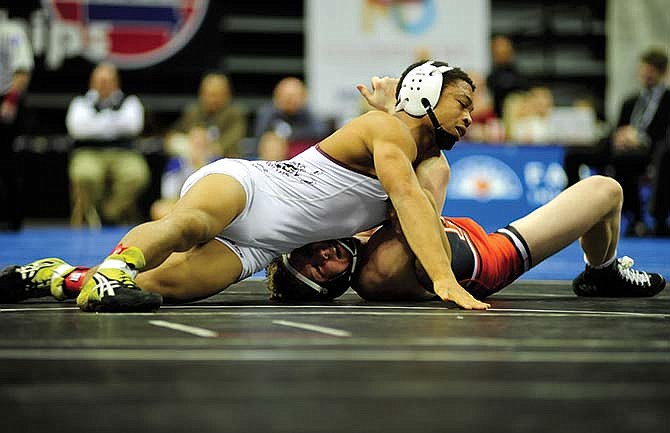 School of the Osage's Chris Johnson (left) wrestles Jarrett Jacques of Kirksville in the Class 2 132-pound championship match at Mizzou Arena.