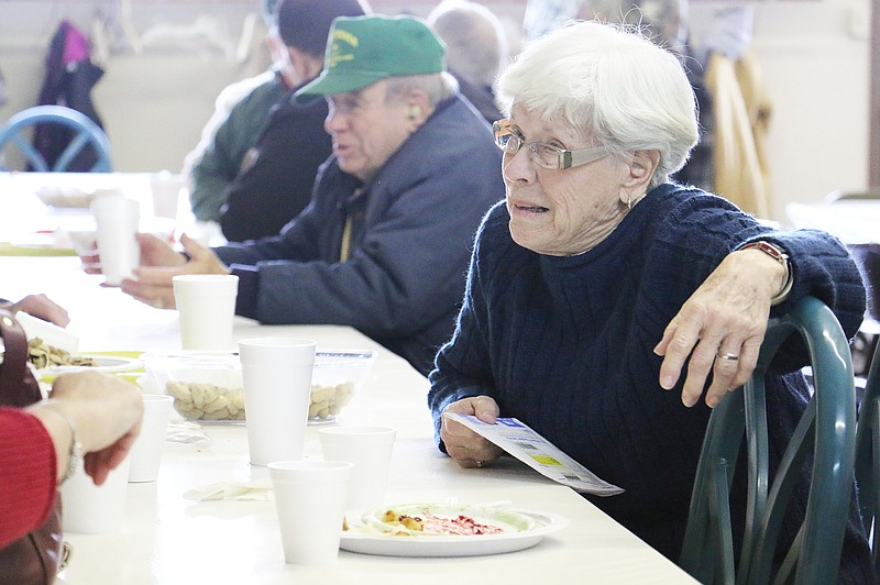 Mary Spradlin talks to friends and eats lunch at the Auxvasse Community Hall Monday afternoon. Monday kicked off the 55th Annual Loafer's Week - an community reunion event held each year in the city. Spradlin said she attends Loafer's Week every year to see friends and enjoy a good meal. Loafer's Week continues today. The Mexico Go Gitters Relay for Life will serve pork loin for $7 at noon.