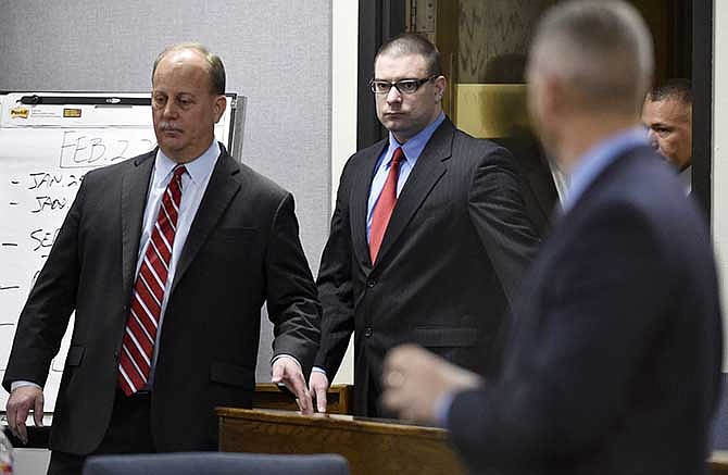 Former Marine Cpl. Eddie Ray Routh, center, enters the court for his capital murder trial at the Erath County, Donald R. Jones Justice Center in Stephenville Texas, on Tuesday, Feb. 24, 2015. Routh, 27, of Lancaster, is charged with the 2013 deaths of Chris Kyle and his friend Chad Littlefield at a shooting range near Glen Rose, Texas. 