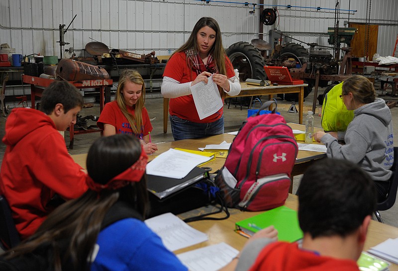 California High School FFA Chapter President Madelyn Jobe helps a contest team prepare.