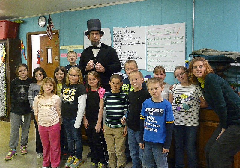Mark Rehagen aka Abe Lincoln with Jamestown's third grade class of Sarah Russell.