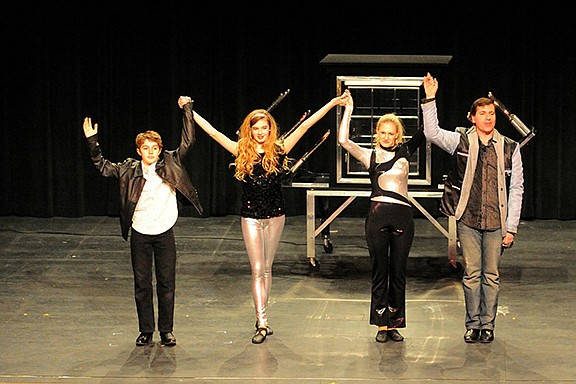 The Gillam family takes a bow after performing its illusion show. From left are David, Marie, Denise and Aaron.