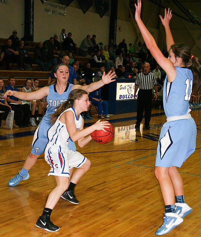 California sophomore Ellie Wirts (center) is trapped by two Father Tolton defenders in Monday night's Class 3, District 8 quarterfinal at South Callaway. The Lady Pintos were victorious, 56-54.