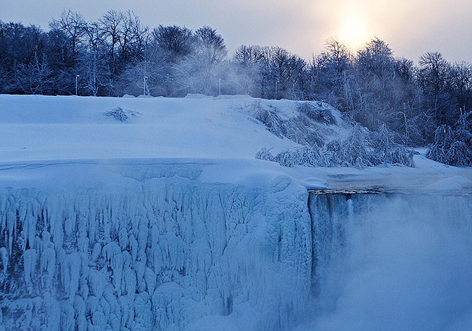 The sun rises over masses of ice formed around the Canadian "Horseshoe' Falls in Niagara Falls, Ontario, Canada, last week.