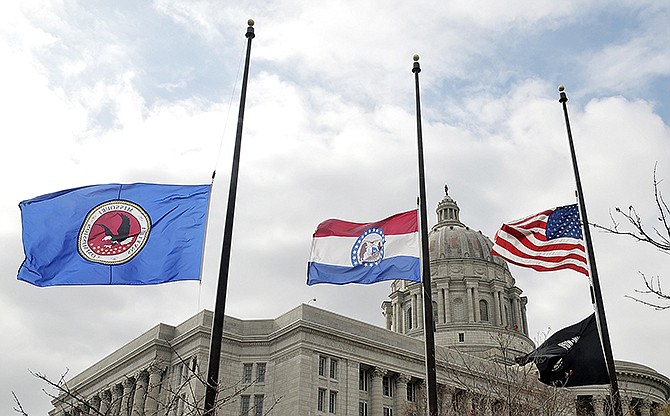 Flags around the Missouri Capitol complex in Jefferson City were lowered to half staff Thursday after the death of statewide elected official, state auditor Tom Schweich, who died Thursday morning. 