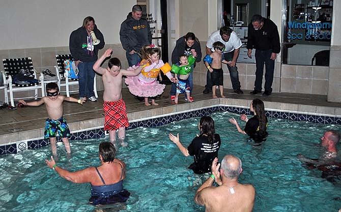 Children leap into the indoor pool at Tan-Tar-A Resort in Osage Beach. Collectively, the 15 registered children, ages 3 to 9, and 14 actual plungers raised $711 for Special Olympics Missouri.