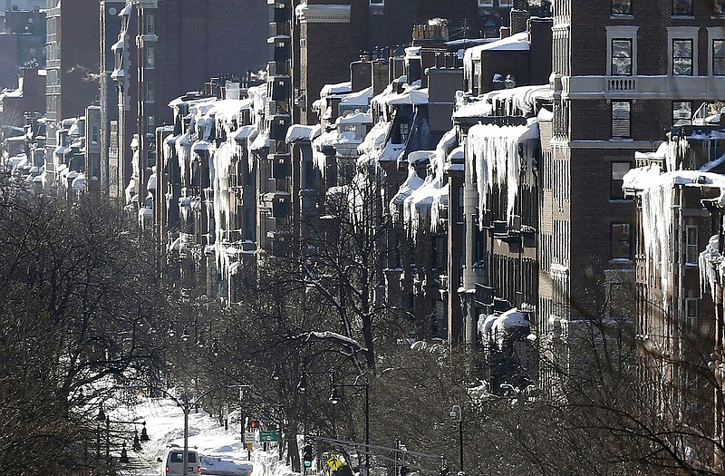 Icicles hang from buildings on Beacon Street in Boston as New England remained bitterly cold after the region's fourth winter storm in a month blew through. 