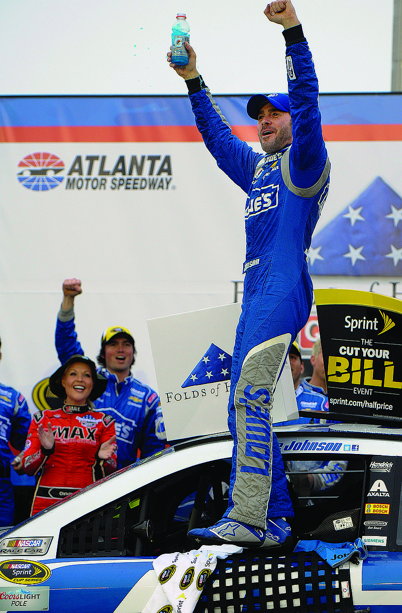 Jimmie Johnson reacts after winning Sunday's Sprint Cup race at Atlanta Motor Speedway in Hampton, Ga.