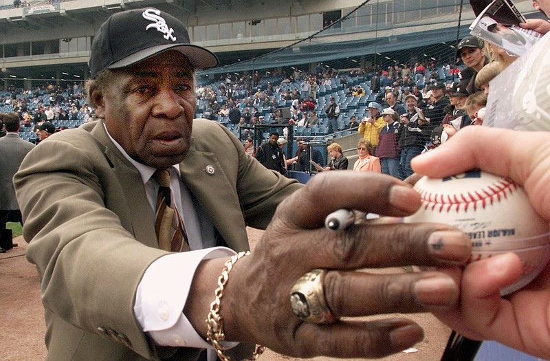 Minnie Minoso, shown signing autographs in 2001, died Sunday.