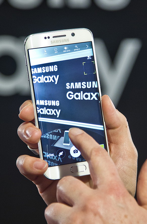 One of two new Samsung phones, the Galaxy S6 Edge, is presented at a special press preview in New York. Samsung officially unveiled the stylish new phones on Sunday.