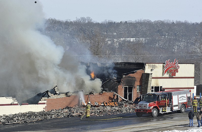 Firefighters from numerous Mid-Missouri districts and departments responded to an early morning fire at Rainbow Lanes and Hook's Sports Bar at Mari-Osa-Delta. Firefighters remained on scene most of the day to battle flare-ups.
