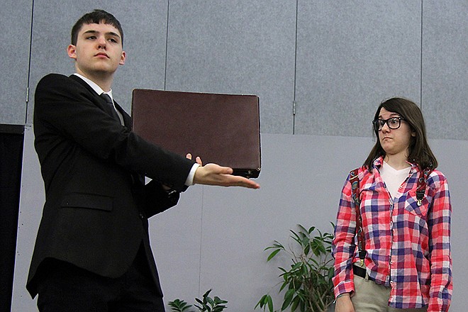 Tom (James Schanbacher), a new NSA agent, talks to Nala (Abby Ward) in "NSA: How to Win Friends and Influence People," a one-act play directed by Calvary Lutheran High School senior Alexander Yaws.