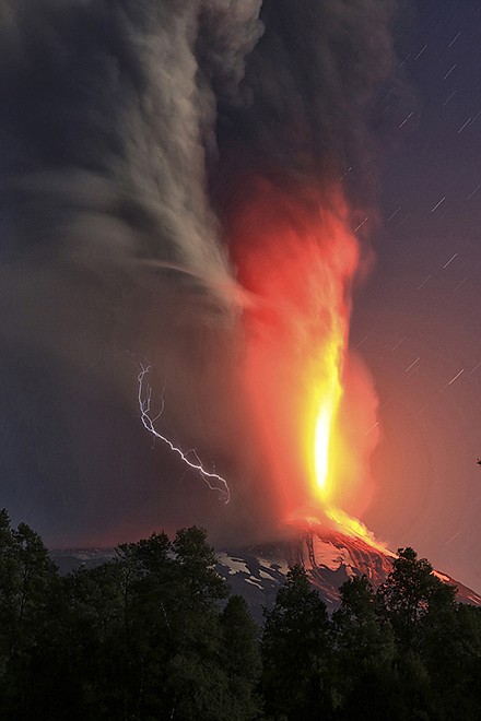 The Villarica volcano erupts Tuesday near Pucon, Chile. The National Emergency Office issued a red alert and ordered evacuations.