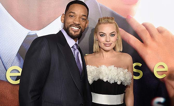 Will Smith, left, and Margot Robbie arrive at the world premiere of "Focus" at the TCL Chinese Theatre on Tuesday, Feb. 24, 2015, in Los Angeles.