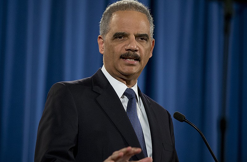 Attorney General Eric Holder speaks at the Justice Department   about the findings related to two investigations in Ferguson.