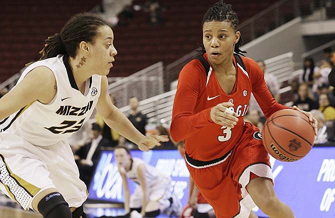 Georgia's Tiaria Griffin (3) takes the ball in front of Missouri's Juanita Robinson (23) in the second half of a Southeastern Conference women's tournament NCAA college basketball game in North Little Rock, Ark., Thursday, March 5, 2015. Georgia defeated Missouri 75-64.