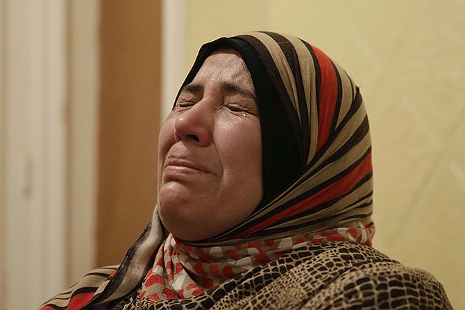 Hayam Salama, mother of Mohammed Ahmed, who was killed on Feb. 1 by an Egyptian policeman, cries during an interview with the Associated Press in Cairo, Egypt.
