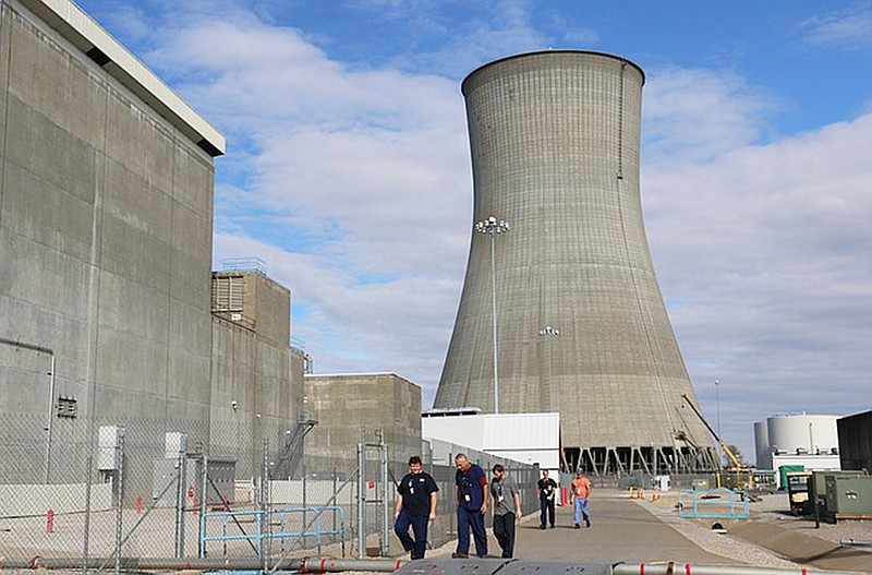 Employees work near the Callaway Energy Center's cooling tower during the nuclear facility's 20th planned refueling and maintenance outage in November 2014. The U.S. Nuclear Regulatory Commission granted the nuclear facility a 20-year license extension Friday.