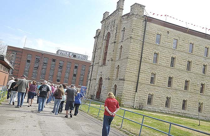 In this News Tribune file photo, a group from southern Missouri and northern Arkansas was the first to tour A-Hall in April 2014 after health and safety issues at the former Missouri State Penitentiary forced an early end to the previous year's tour season. After much work during the closure to remove mold and large paint chips and a sealant applied to the structures, tours continued at the historic site in Jefferson City.